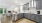 Kitchen with stainless steel appliances and quartz countertop.